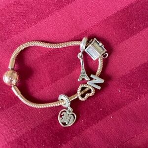 Pandora rose gold bracelet and charms